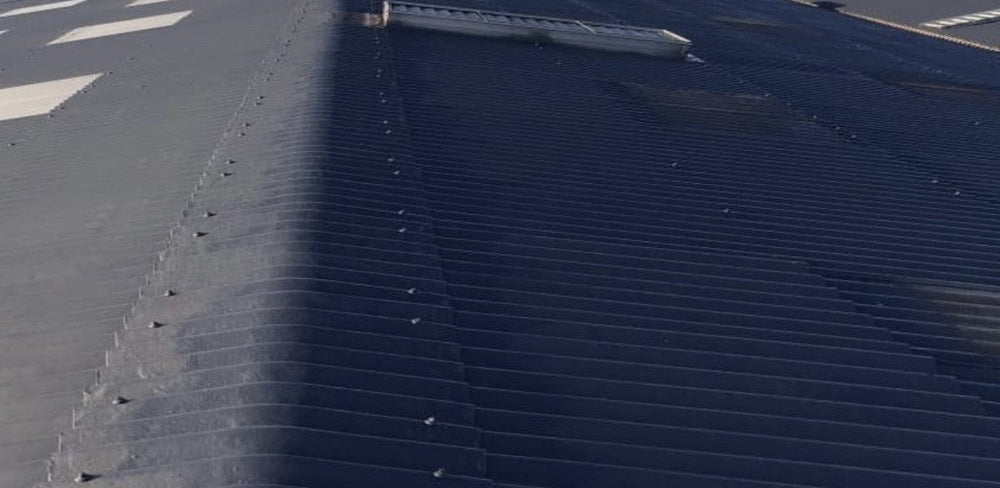 Refurbished industrial roof illustrating planned asset-life extension