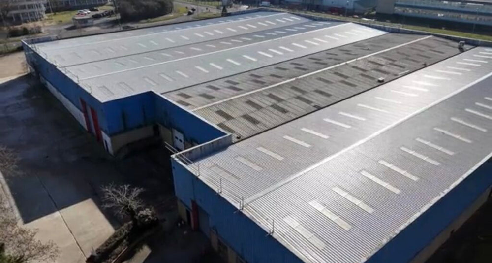 Large industrial roof and cladding project illustrating warehouse envelope planning in Swindon